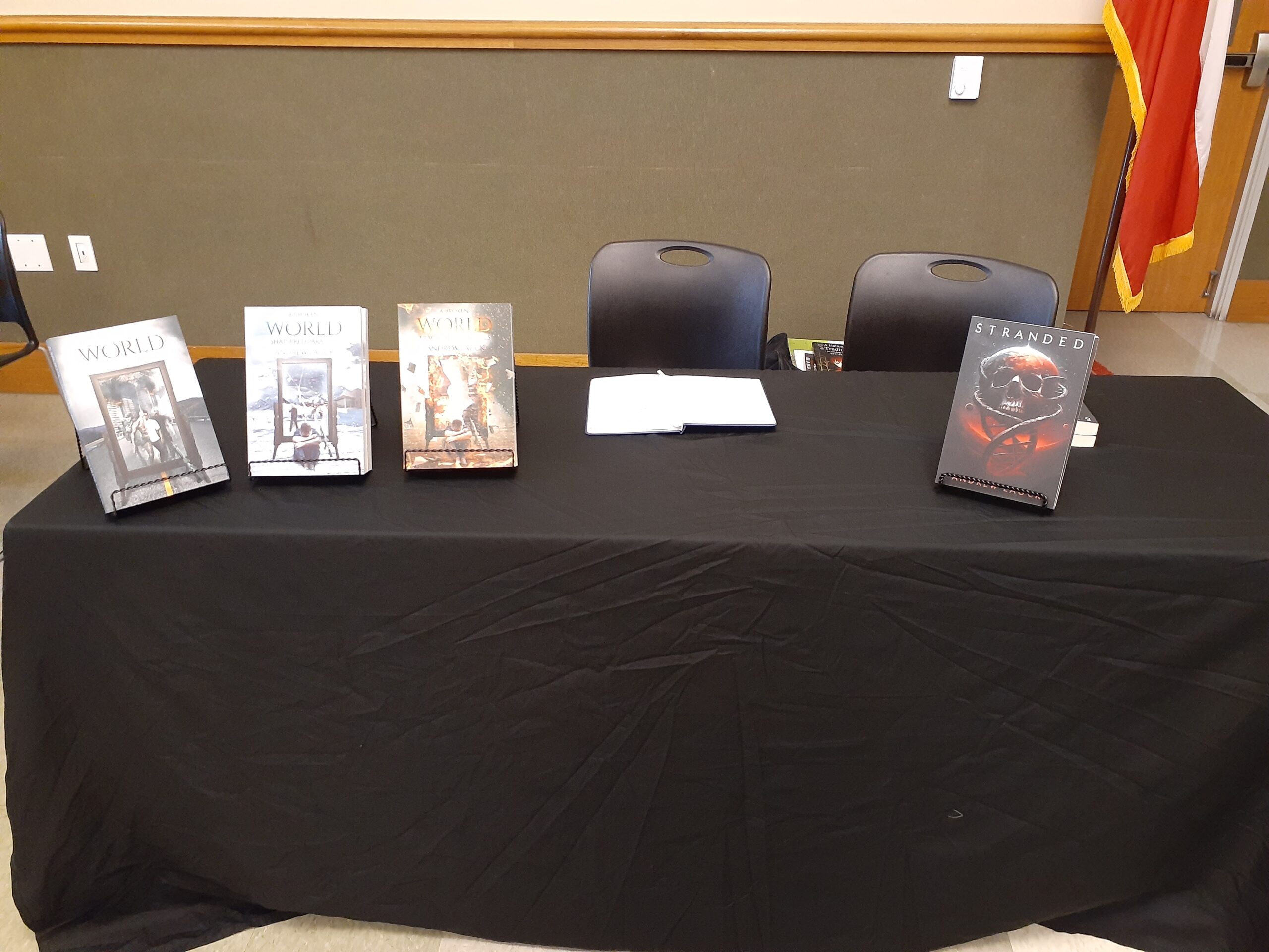 Table display at a book signing with the Broken World trilogy and Stranded.